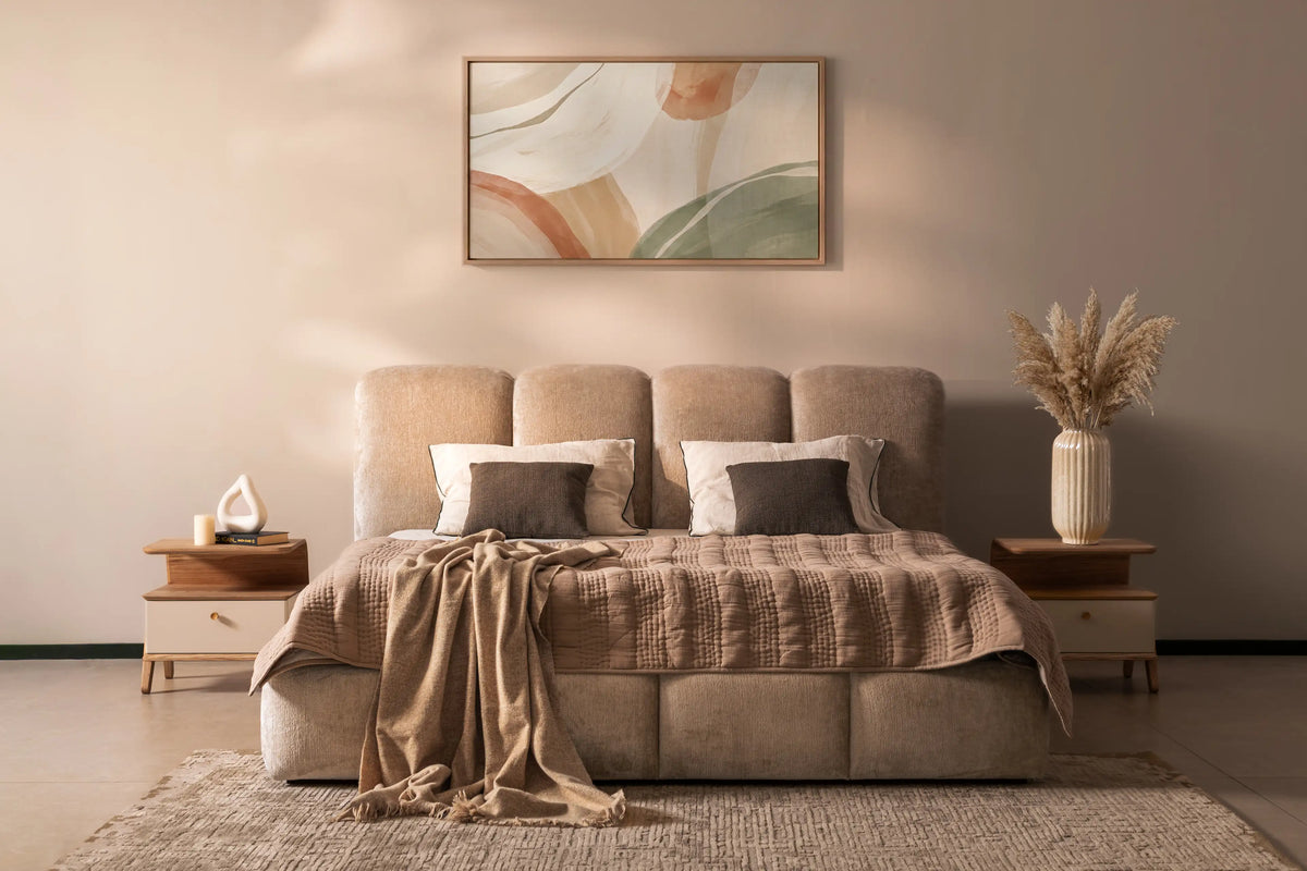 Neatly made bed with decorative pillows in a bedroom setting. Ella Bed and Fable Bedside  | VITTI Living