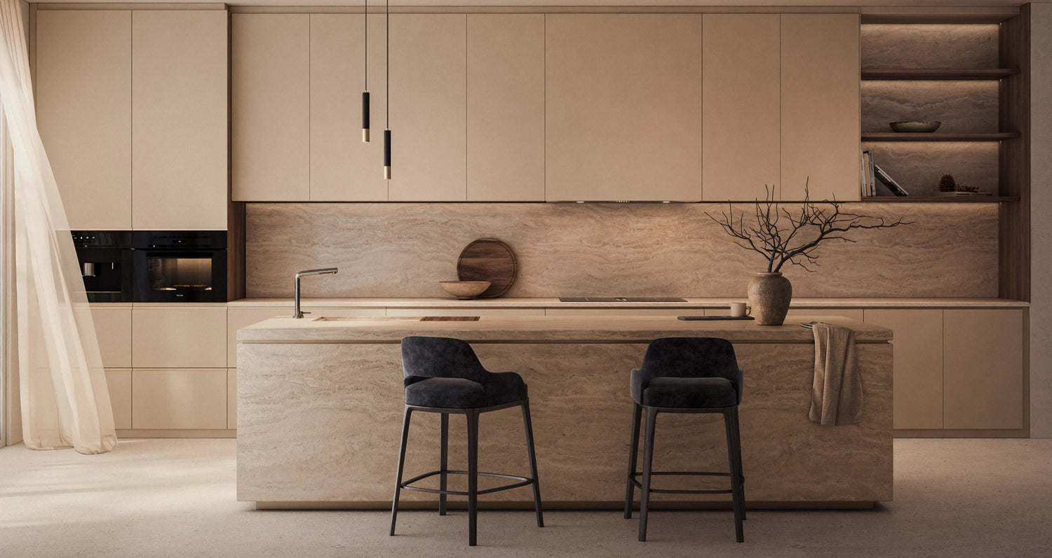 Modern kitchen with beige cabinets, island, and black bar stools.